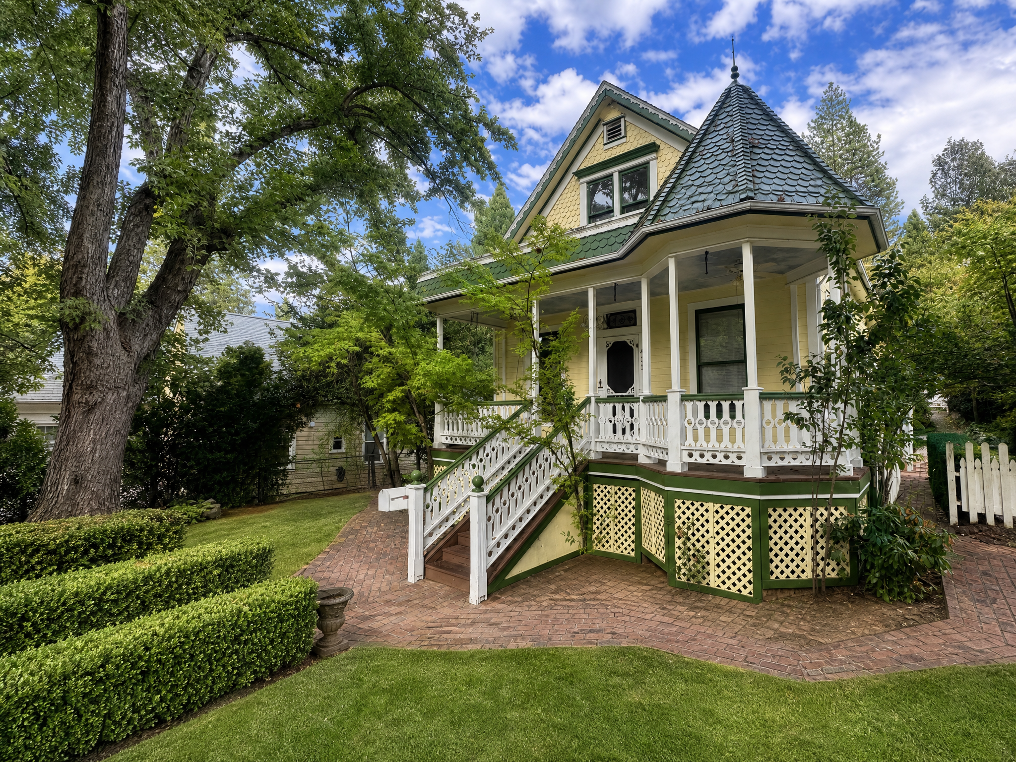 Atman House, historic circa-1880 Victorian exterior with turret and wraparound porch