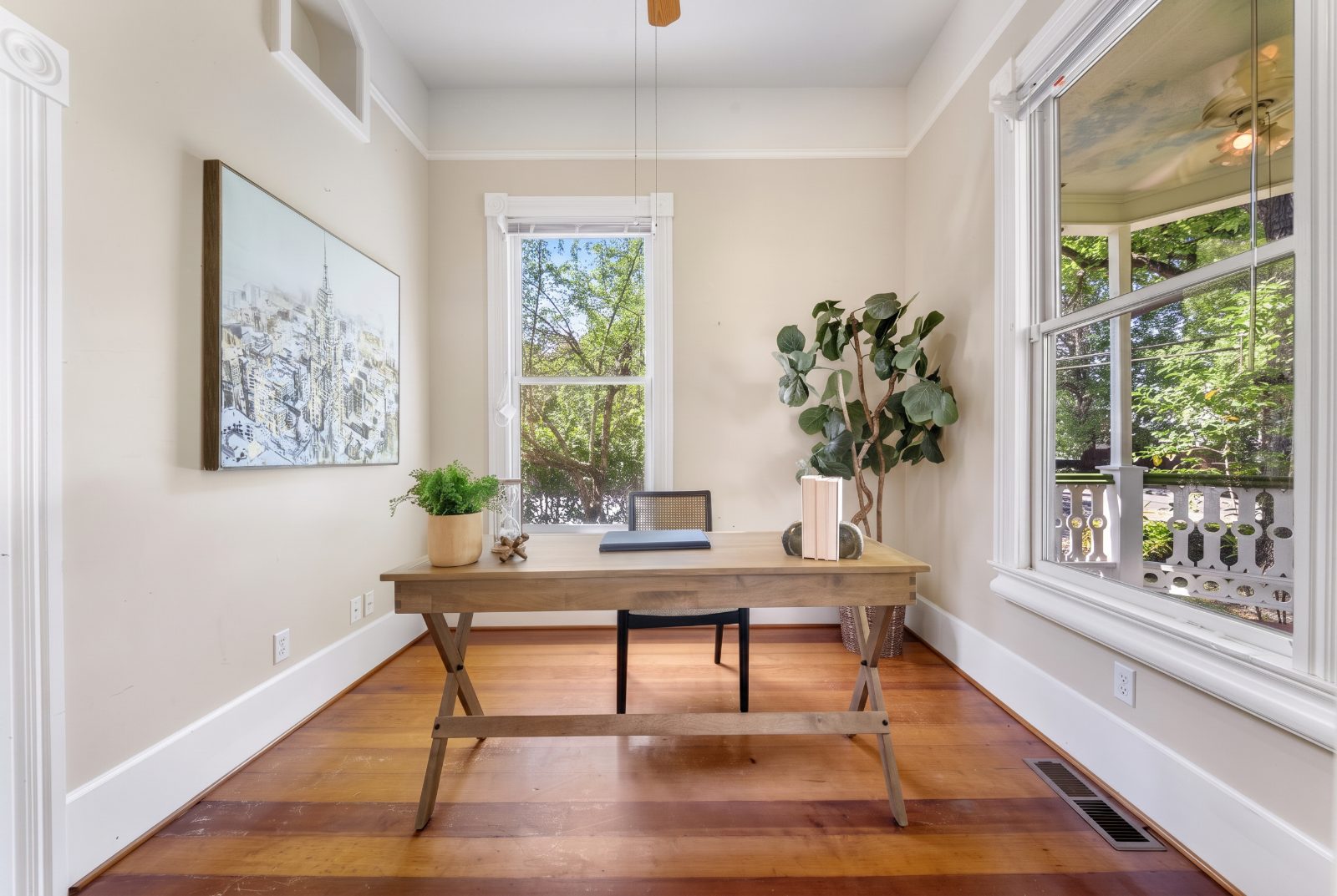 Quiet study with corner windows and fir floors